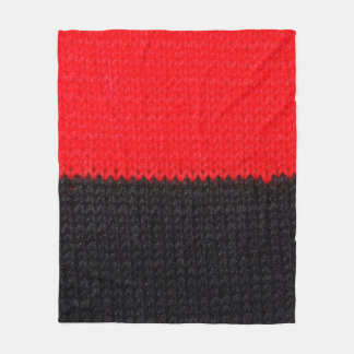 mooi zwart en rood gebreid weefsel met een tekenin fleece deken