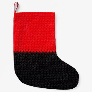 mooi zwart en rood gebreid weefsel met een tekenin kleine kerstsok