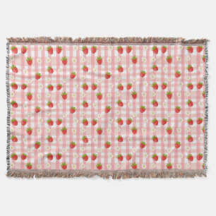Mooie aardbei en bloemen op een roze geruit deken