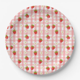 Mooie aardbei en bloemen op roze geruit papieren bordje