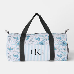 Mooie blauwe bloemen en blauwe gestreepte monogram plunjezak