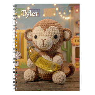 Mooie gehaakte aap met banaan in de dierentuin notitieboek