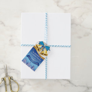 Mooie gouden kerstklokken met blauwe strik cadeaulabel
