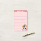 Mooie hond met bloemen op roze post-it® notes (Op bureau)