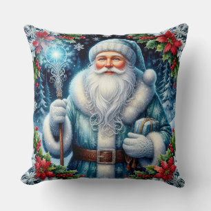 Mooie in het blauw geklede kerstman met winterdeco kussen