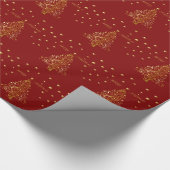 Mooie metallic gouden kerstboom op donkerrood cadeaupapier (Hoek)