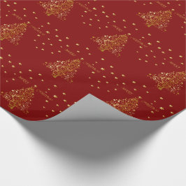 Mooie metallic gouden kerstboom op donkerrood cadeaupapier