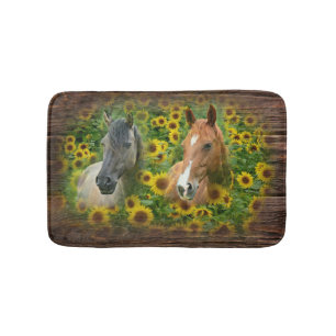 Mooie paarden op het gebied van zonnebloemen badmat