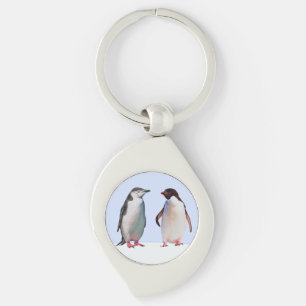 Mooie pinguïn vogelkoppel op lichtblauw sleutelhanger