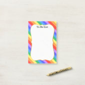 Mooie regenboogkleuren post-it® notes (Op bureau)