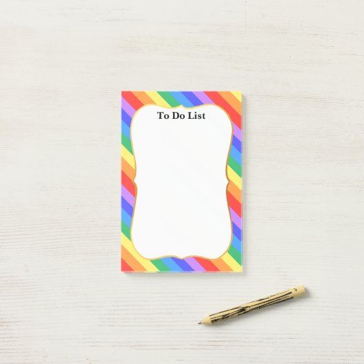 Mooie regenboogkleuren post-it® notes (Op bureau)