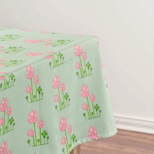 Mooie roze bloemen op lichtgroene tablet tafelkleed (Voorbeeld)