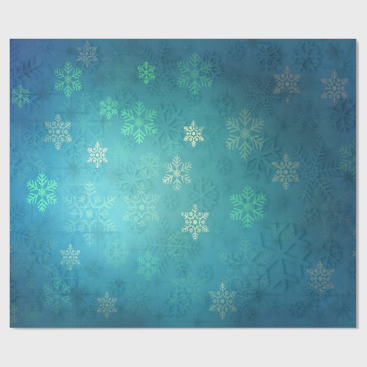 Mooie sneeuwvlokken op de schaduw van blauw-groen cadeaupapier (Vlak)
