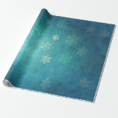 Mooie sneeuwvlokken op de schaduw van blauw-groen cadeaupapier (Uitgerold)