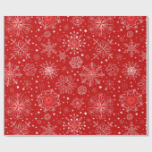 Mooie sneeuwvlokken op rode achtergrond met kerstm cadeaupapier (Vlak)
