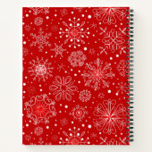 Mooie sneeuwvlokken op rode achtergrond met kerstm notitieboek (Achterkant)