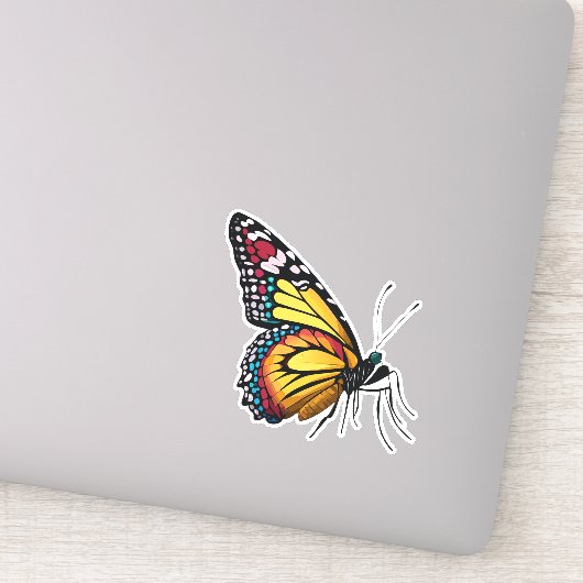 Mooie veelkleurige vlinder sticker (Detail)