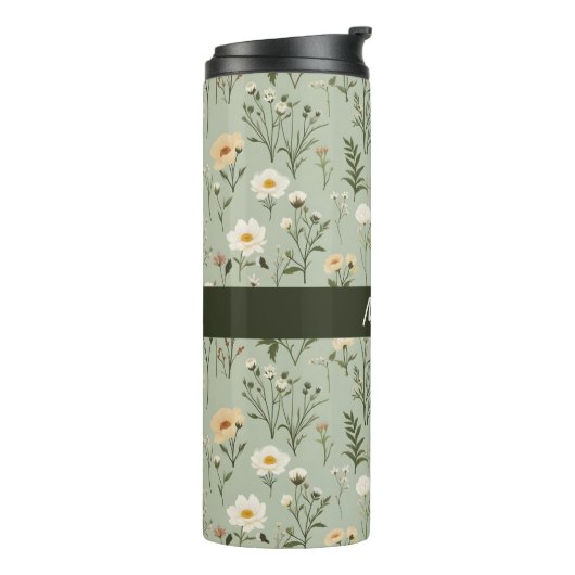 Mooie weide bloemen op groen thermosbeker (Gedraaid links)