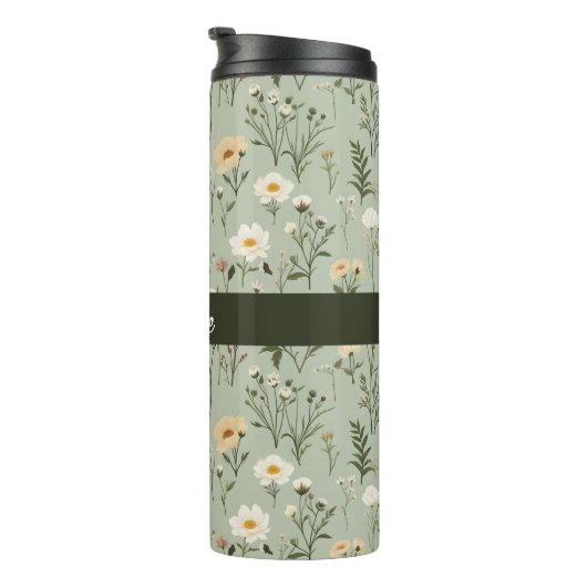 Mooie weide bloemen op groen thermosbeker (Geroteerd rechts)