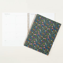 Mooie wilde bloementuin op donker teal planner