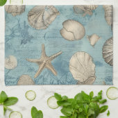 Mooie zeeschelpen in blauw theedoek (Gevouwen)