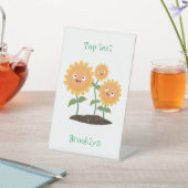 Mooie zonnebloemen die cartoon glimlachen reclamebord met voetstuk (Insitu)