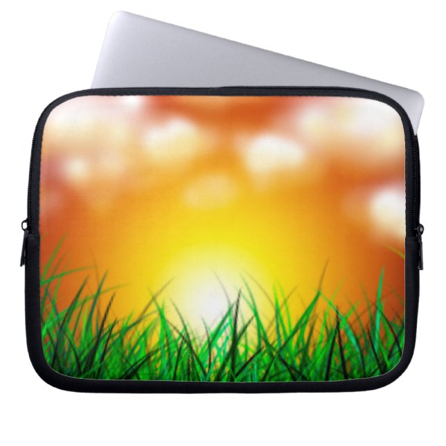 Mooie zonsopgang over een grasveld laptop sleeve (Voorkant)