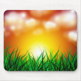 Mooie zonsopgang over een grasveld muismat