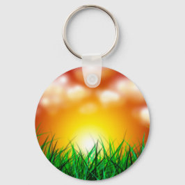 Mooie zonsopgang over een grasveld sleutelhanger