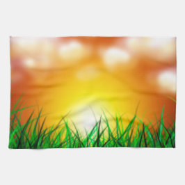 Mooie zonsopgang over een grasveld theedoek