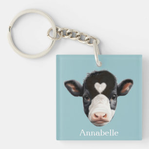Mooie zwart-witte koeienkop op hemelsblauw sleutelhanger