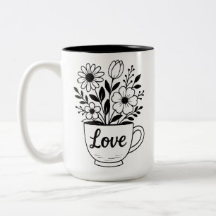 Mooie zwarte theekop met bloemen mok