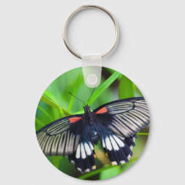 Mooie zwarte, witte en rode vlinder sleutelhanger