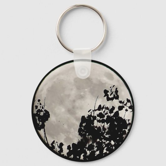 Moon achter donkere bladeren sleutelhanger (Voorkant)
