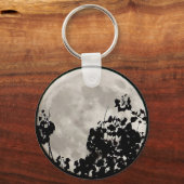 Moon achter donkere bladeren sleutelhanger (Voorkant)