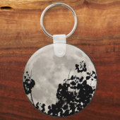Moon achter donkere bladeren sleutelhanger (Voorkant)