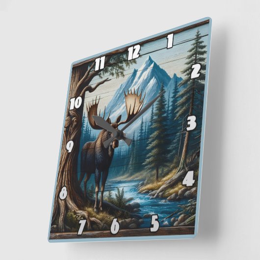 Moose bij rivier met bergen achter vierkante klok (Hoek)