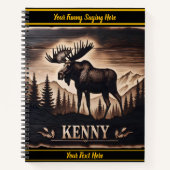 Moose houtsnijwerk in donker hout met achtergrond notitieboek (Voorkant)