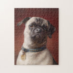 Mops | Carl Reichert Legpuzzel<br><div class="desc">Mops | Carl Reichert’s Mops is a captivating portrait of a curious-looking pug set against a moody burgundy background. The painting highlights the pug’s expressive face and wrinkled features, rendered with exquisite detail and lifelike texture. The rich tones of the background create a dramatic contrast, emphasizing the playful yet dignified...</div>