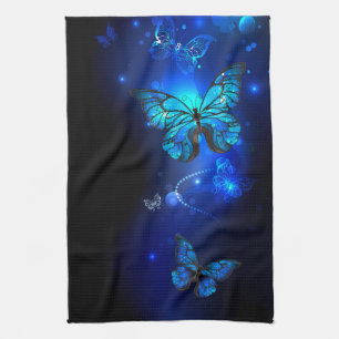Morpho Butterfly in de donkere achtergrond Theedoek