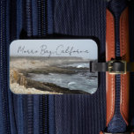 Morro Bay California Ocean Cliffs Photography Bagagelabel<br><div class="desc">A foggy overcast day in Morro Bay California with the ocean waves hitting the rocks on the shore in this beach photograph souvenir. This seaside travel photo luggage tag features black cursive script above the beach rocks and grey sky.</div>