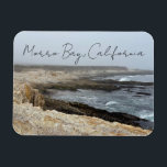 Morro Bay California Ocean Cliffs Photography Magneet<br><div class="desc">A foggy overcast day in Morro Bay California with the ocean waves hitting the rocks on the shore in this beach photograph souvenir. This seaside travel photo keepsake magnet gift features black cursive script above the beach rocks and grey sky.</div>