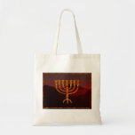 Moshe's Menorah Tote Bag<br><div class="desc">In de Torah Moshe Rabbenu wordt gezegd: "Je zult een Menorah van zuiver goud maken, geslagen, de Menorah wordt gemaakt, zijn basis, zijn tak, zijn goblets, zijn knoppen, en zijn bloemen zullen er vanaf worden gehammerd, " [Shmot 25:31] en later, "Zie, en bouw, volgens hun vorm die je op de...</div>