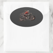 MOTORFIETS OP KOOLSTOFVEZEL. OVALE STICKER (Tas)
