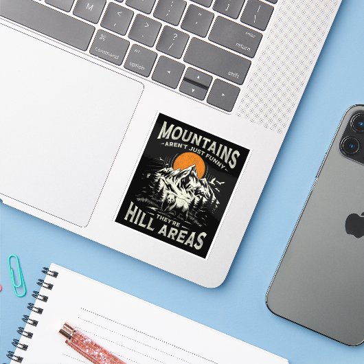 Mountains Aren't Funny They're Hill Areas Sticker (Laptop met iPhone)