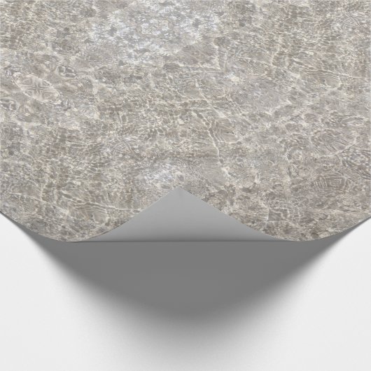 Mousserend water op strandzand en verpakkingspapie cadeaupapier (Hoek)