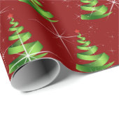 Mousserende groene lint kerstbomen op rood cadeaupapier (Rol Hoek)