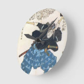 Musashi Miyamoto 宮 本 武 met twee Bokken Ronde Klok (Hoek)