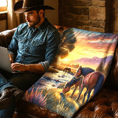 Mustangpaard dat bij zonsondergang graast bij een  fleece deken
