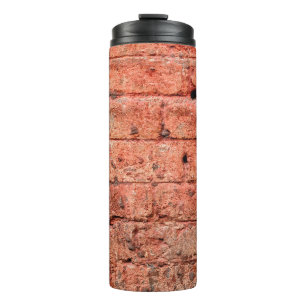 muur met een paar stenen erin, steen thermosbeker